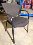 Used Side chair with textured charcoal fabric and black frame 