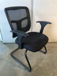Used Guest chair with web back and black fabric seat 