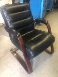 Used Guest chairs with black vinyl upholstery and mahogany frame 