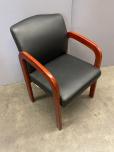 Used Used Guest Chair With Black Vinyl Upholstery And Cherry Arms 