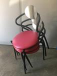 Used Stacking chairs with red vinyl and black frame 