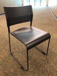 Used Stacking chairs with perforated black seat and black frame 