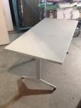 Used Training table with grey textured laminate finish and grey legs 