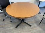Used Round Table With Medium Tone Laminate Top And Black Base - ITEM #:210056 - Thumbnail image 1 of 2