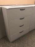 Used 4-drawer lateral file cabinet with light brown finish 