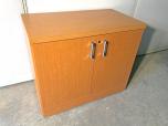 Used Small storage cabinet with very nice medium tone laminate 