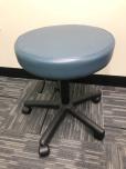 Used Dynatronics Pneumatic Stool with blue seat 