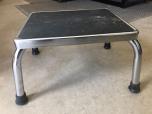 Used Footstool - chrome with black rubber pad and feet 