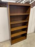 Used Used bookcase with walnut veneer finish 